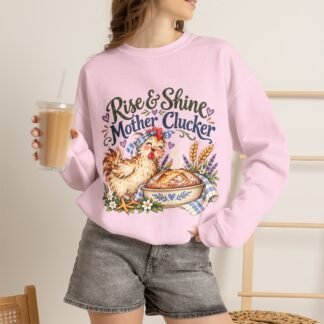Rise n Shine, Mother Clucker! Funny Sourdough Baking Crewneck SweatshirtFor the woman who talks to her sourdough starter, has flour on her clothes, and knows the bread isn't going to bake itself. Some mornings start with coffee. Others start with a sourdough starter demanding attention, a loaf that needs shaping, and a chicken announcing to the entire neighborhood that it's officially time to get up. Rise & Shine, Mother Clucker! This cozy crewneck sweatshirt celebrates the wonderfully chaotic life of a home baker. Featuring an adorable, slightly sassy hen alongside a freshly baked sourdough loaf, surrounded by soft watercolor wildflowers, wheat, and vintage farmhouse charm, it's the perfect combination of country-cottage sweetness and a little barnyard attitude. Whether you're feeding your starter (again), waiting for your dough to rise, baking bread for the neighbors, or enjoying that first cup of coffee while pretending you don't have chores to do, this sweatshirt gets you. Soft, comfortable, and made for everyday wear, it's just as at home in the kitchen as it is at the farmers market, the chicken coop, or curled up on the couch with a slice of warm bread. Perfect for: Sourdough bakers who have named their starters Bread-loving homestead mamas Backyard chicken keepers with a sense of humor Cottagecore enthusiasts and from-scratch kitchen queens Anyone who believes a little flour and a lot of laughter make life better A fun gift for the bread baker who already has everything, except one more reason to laugh at herself. From the Hobo Homesteading General Store, where we believe in using what you've got, growing what you can, and making a life you love. Because life's too short for boring sweatshirts and store-bought bread.